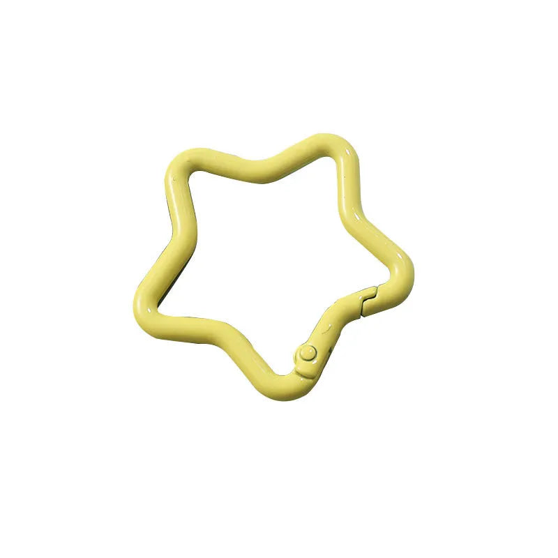 Zinc alloy five-pointed star keychain in assorted macaron colours including pink, blue, and purple