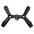 Black leather chest muscle bondage strap with metal buckle and rivet details