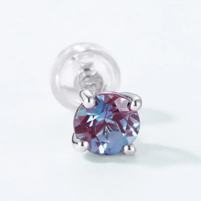 Geometric round silver ear studs with cultivated Alexandrite stone centre