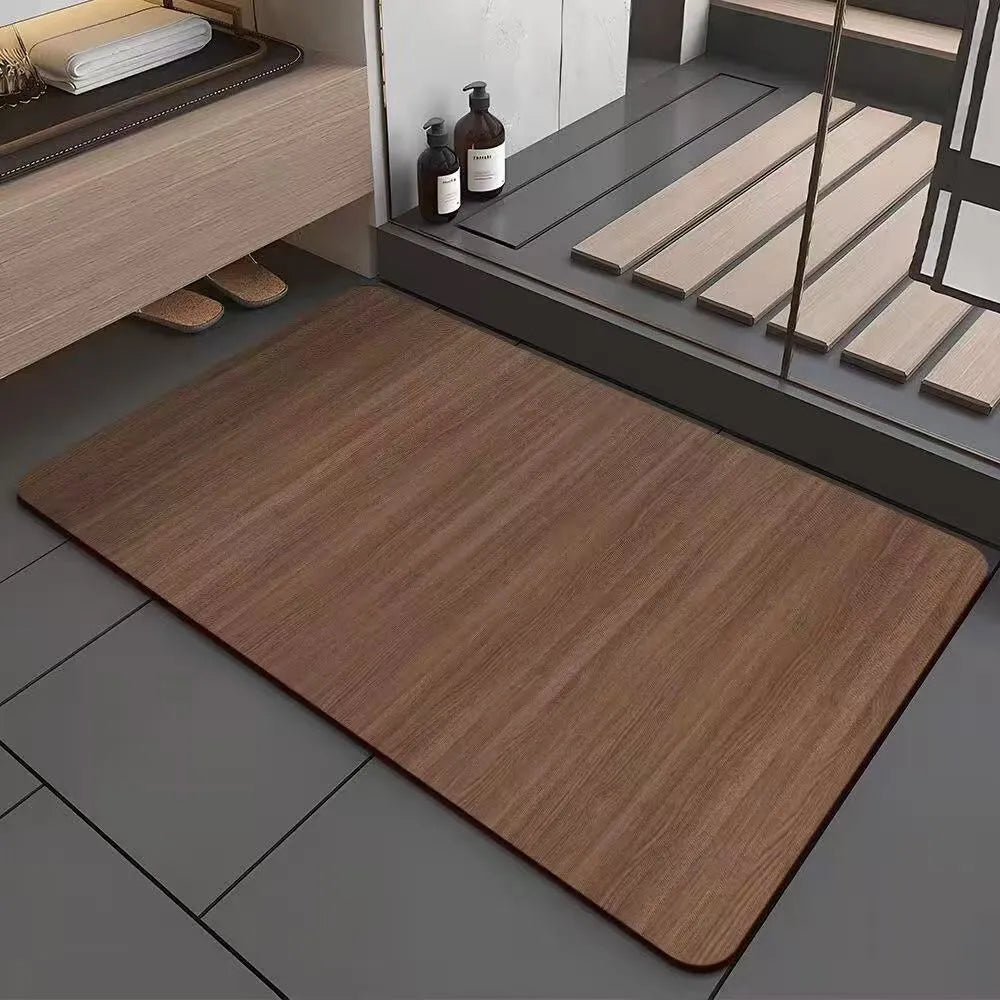 American-style square bath mat with wood grain pattern on a bathroom floor.