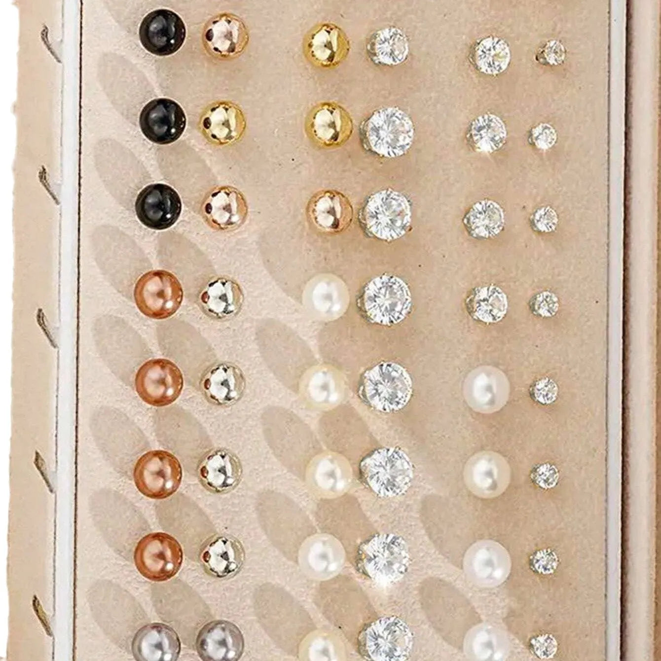 108 gold and yellow alloy stud earrings with geometric shapes and round pearl details on a plain surface.