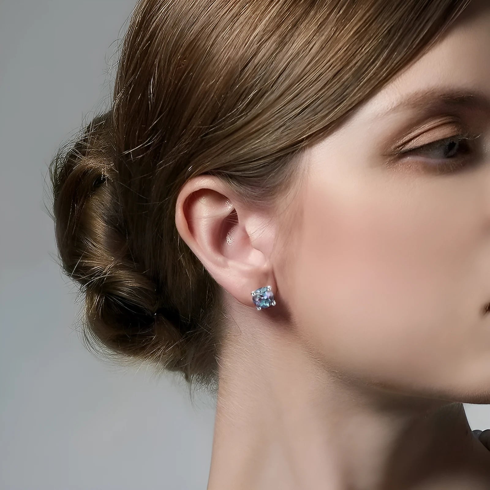 Geometric round silver ear studs with cultivated Alexandrite stone centre