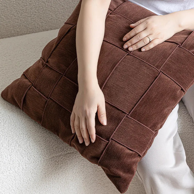 Square chenille woven cushion in beige colour showing textured surface