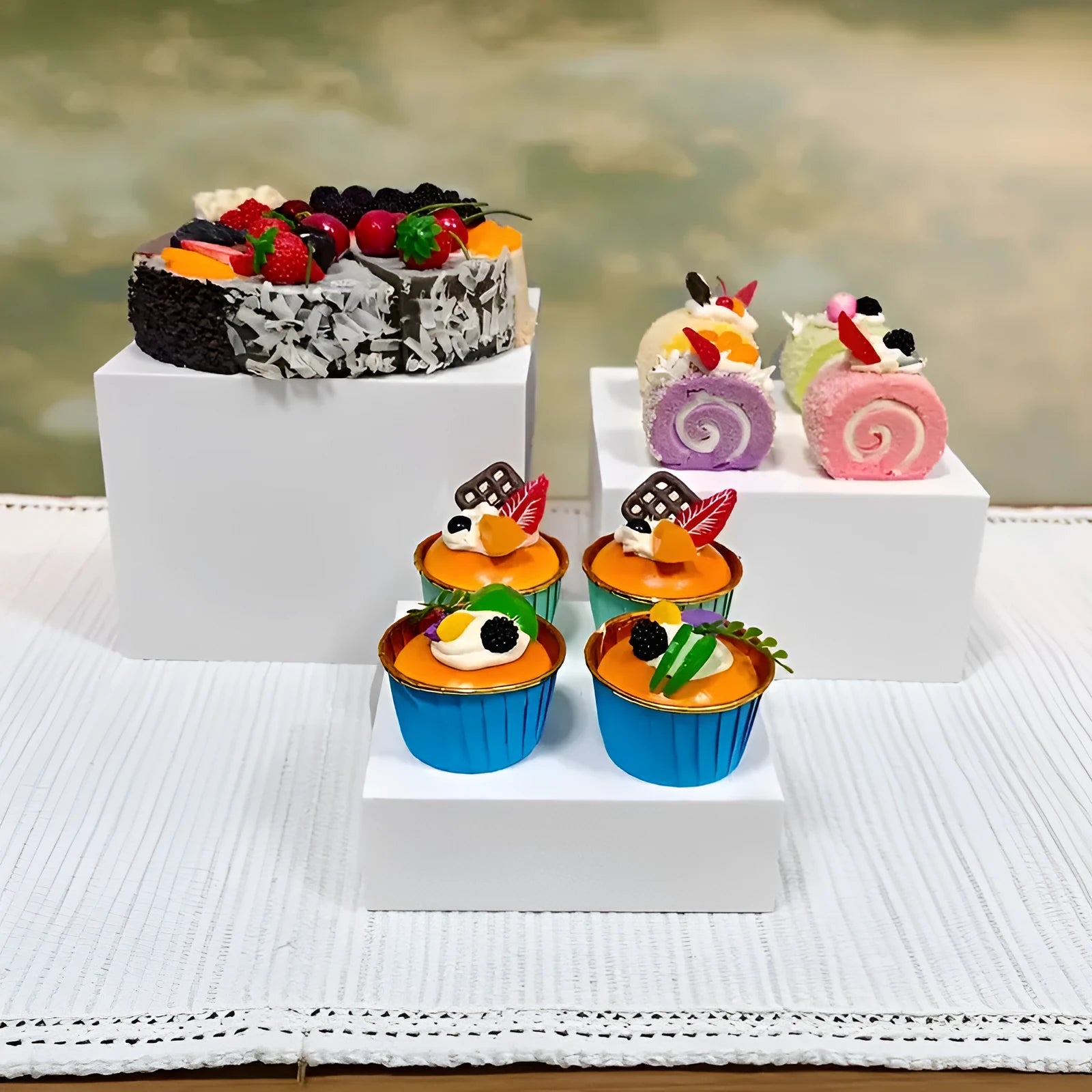 White and transparent plastic dessert display cube sets showing stackable 6-piece arrangements for cakes and pastries