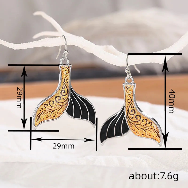 Women's fishtail earrings with whale motif in white gold colour retro style design
