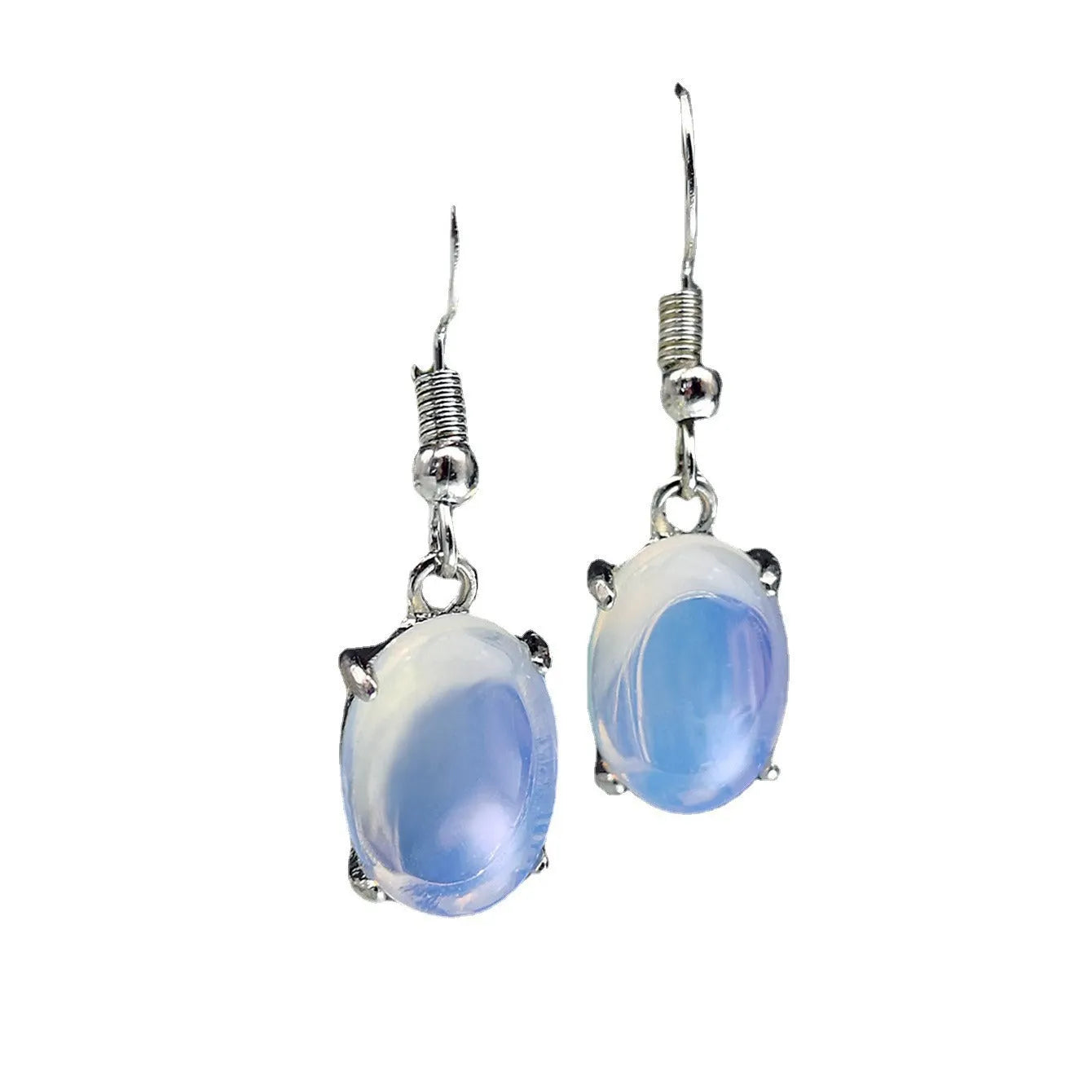 A pair of retro drop-shaped earrings with a cross design in moonlight opal colour on a white background.