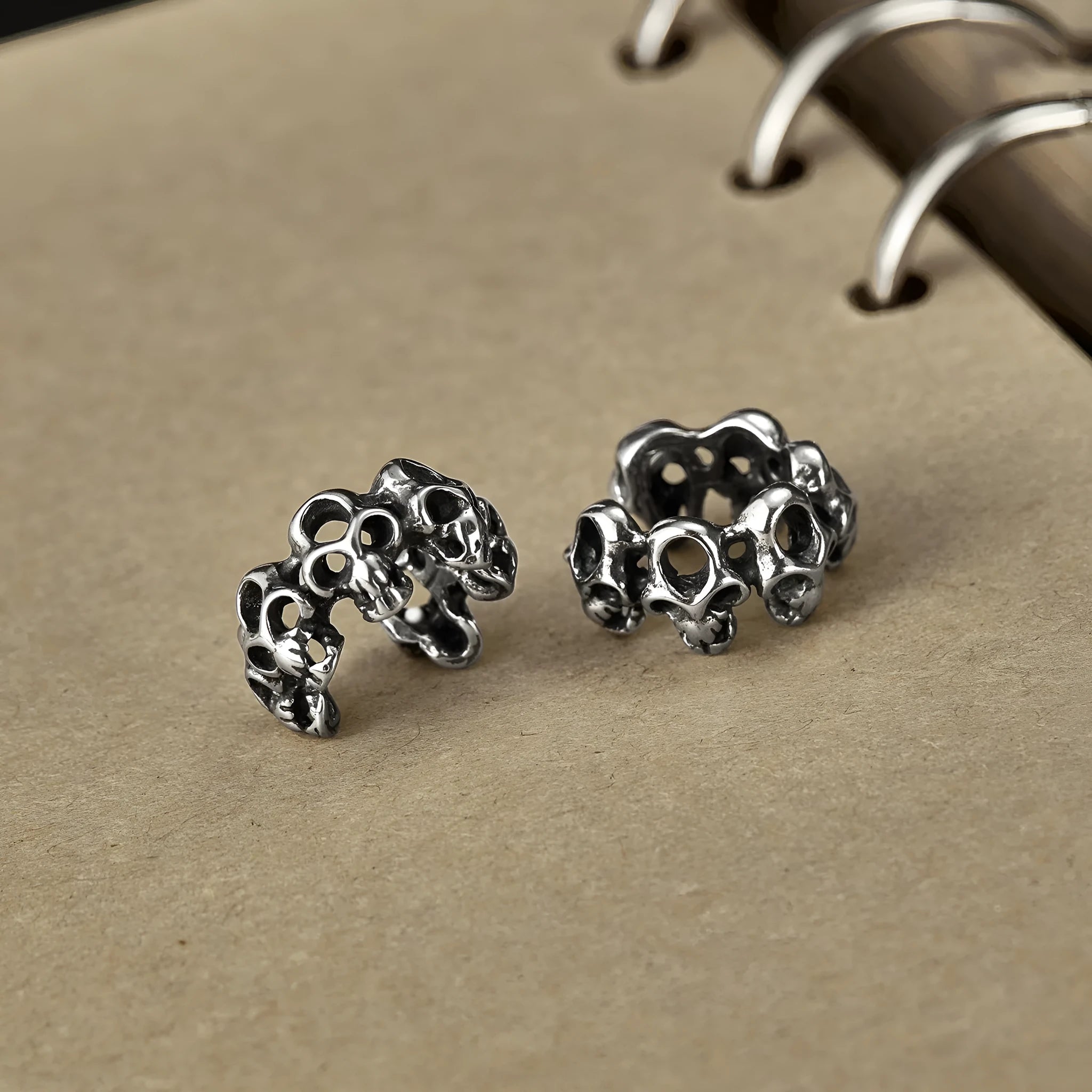 Stainless steel skull ear clip earrings with hollow geometry design and electroplated finish
