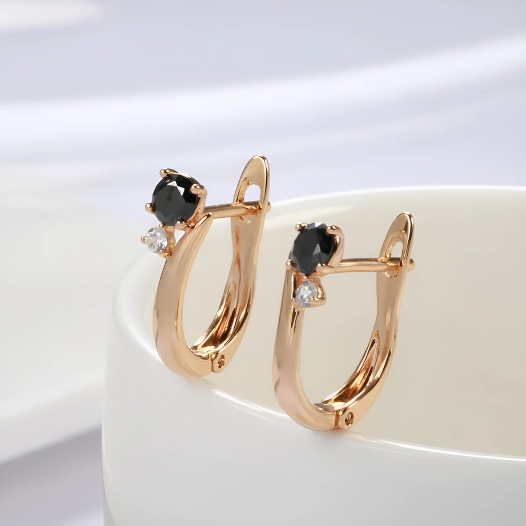 Women's drop shape earrings with black agate stones and gold-plated copper geometric design