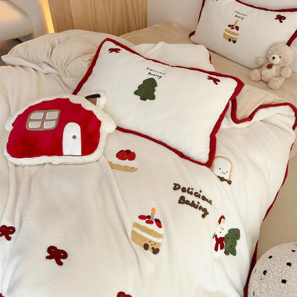 Cartoon winter-themed children's bedding four-piece set with duvet cover, sheet, and pillowcases.