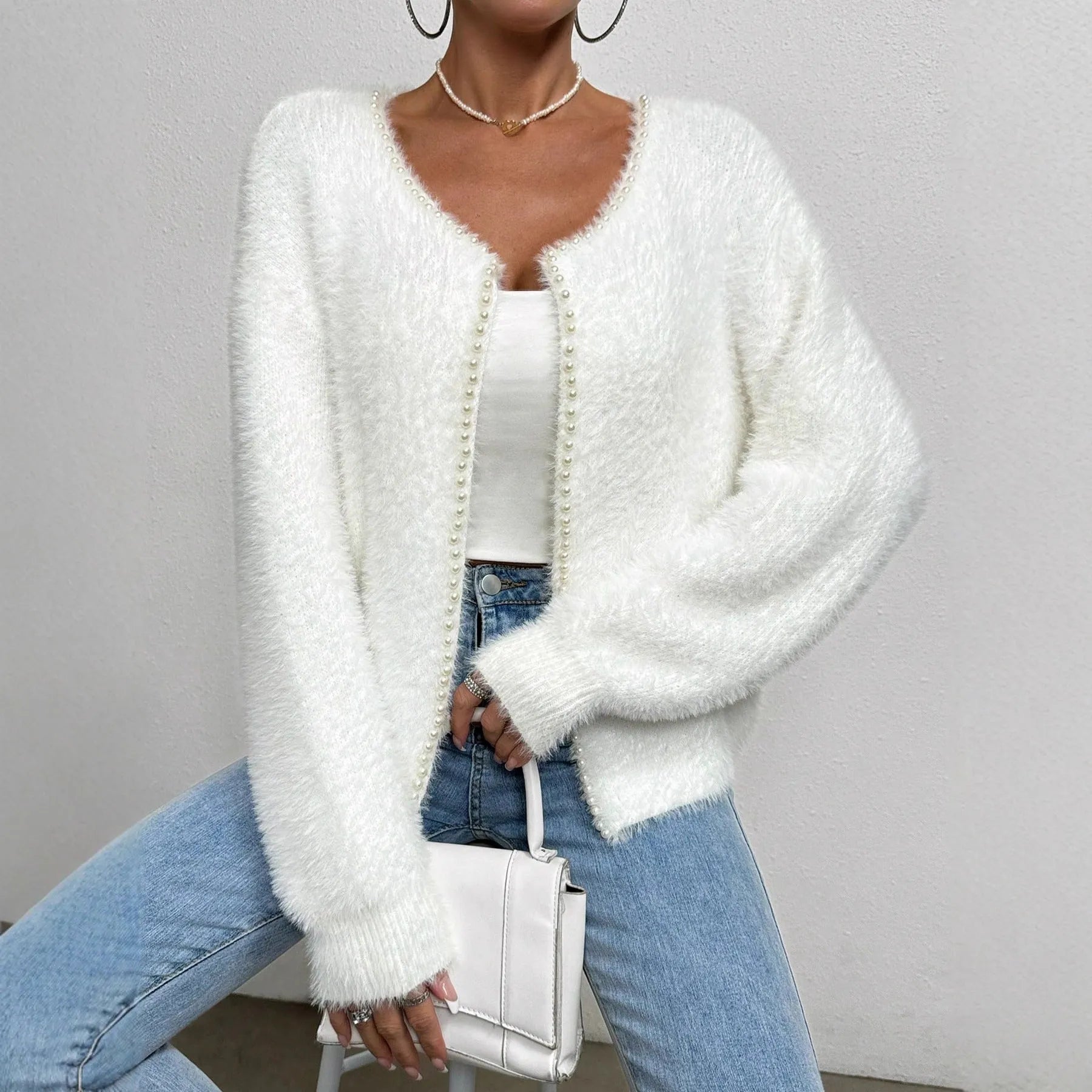 White women's V-neck cardigan with bead details, shown as a knitwear coat.