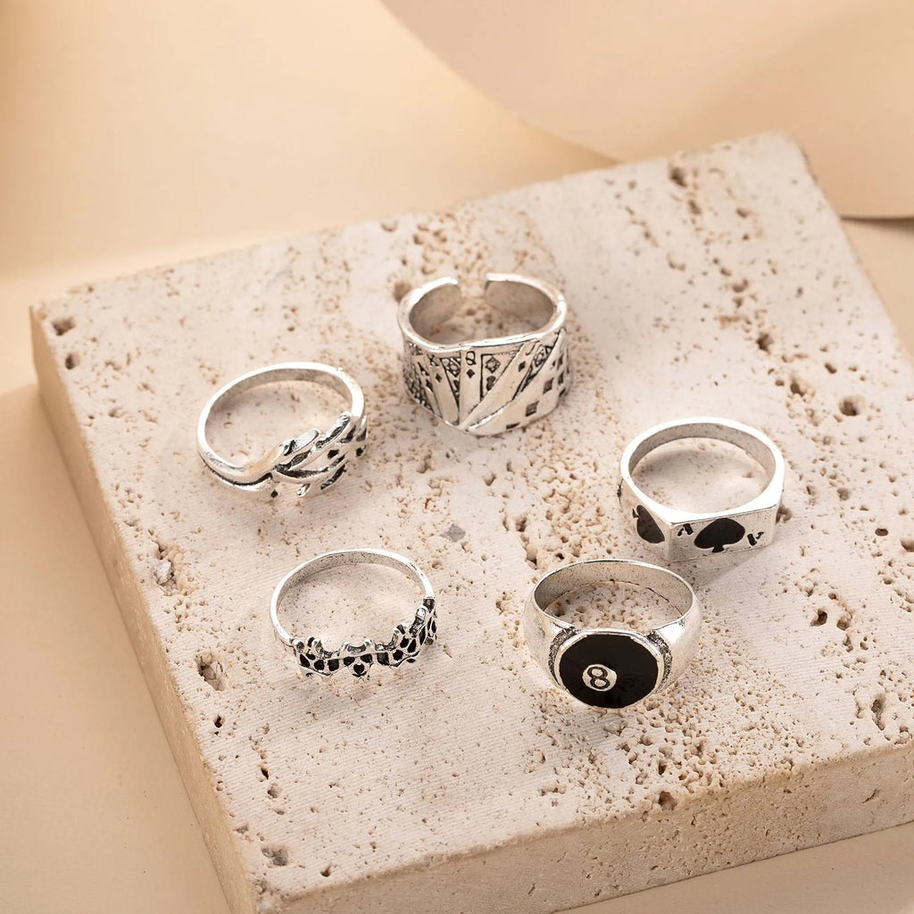 Black alloy ring with a raised retro spade card design on top.