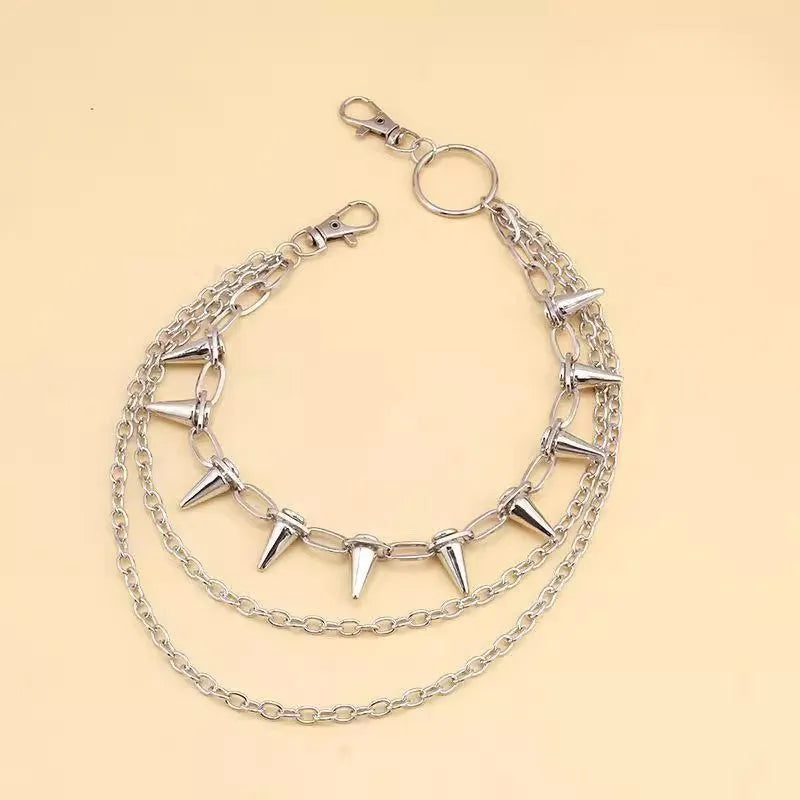Silver metal pants chain with double layer design and punk rivet ornaments on dark background