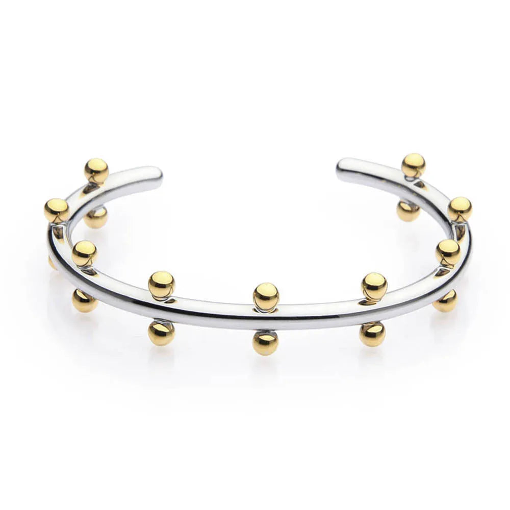 Stainless steel C-shaped bracelet with textured bean beads in gold finish.