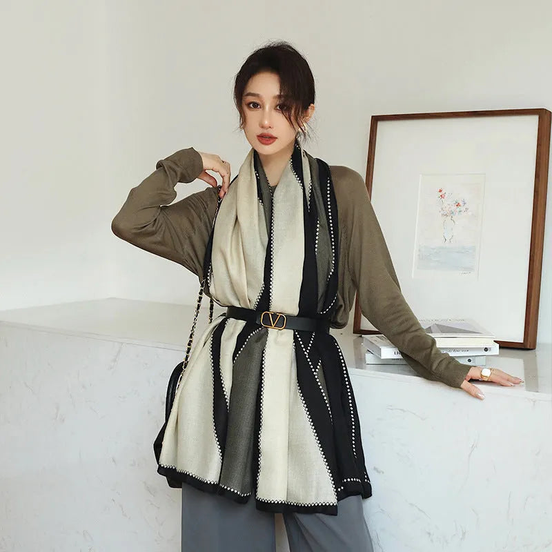 A woman wearing a printed polyester shawl measuring 180cm by 90cm.