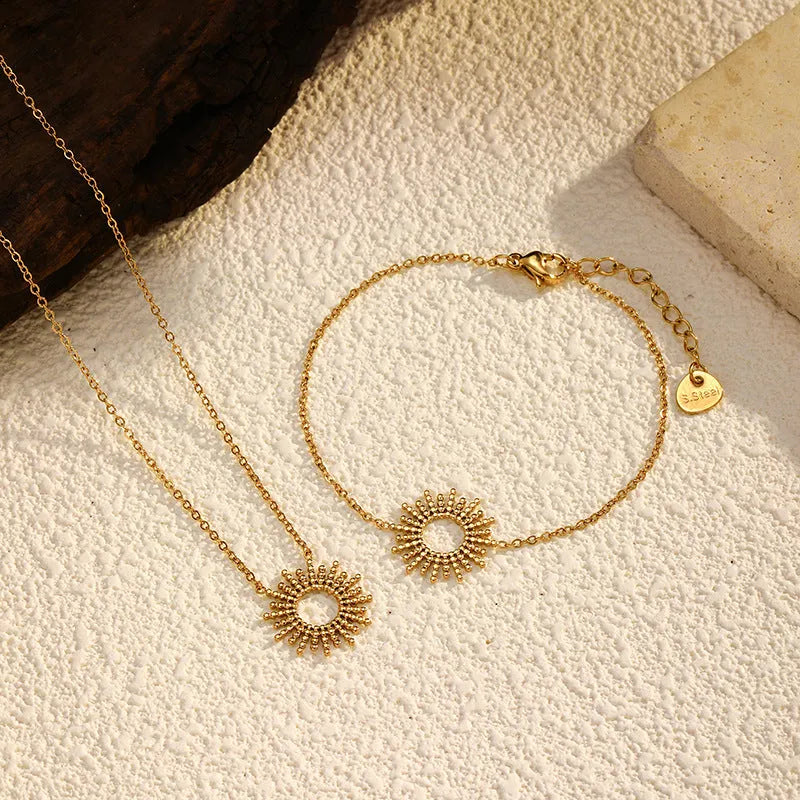 Gold plated stainless steel sunflower necklace and bracelet set with geometric chain design for women