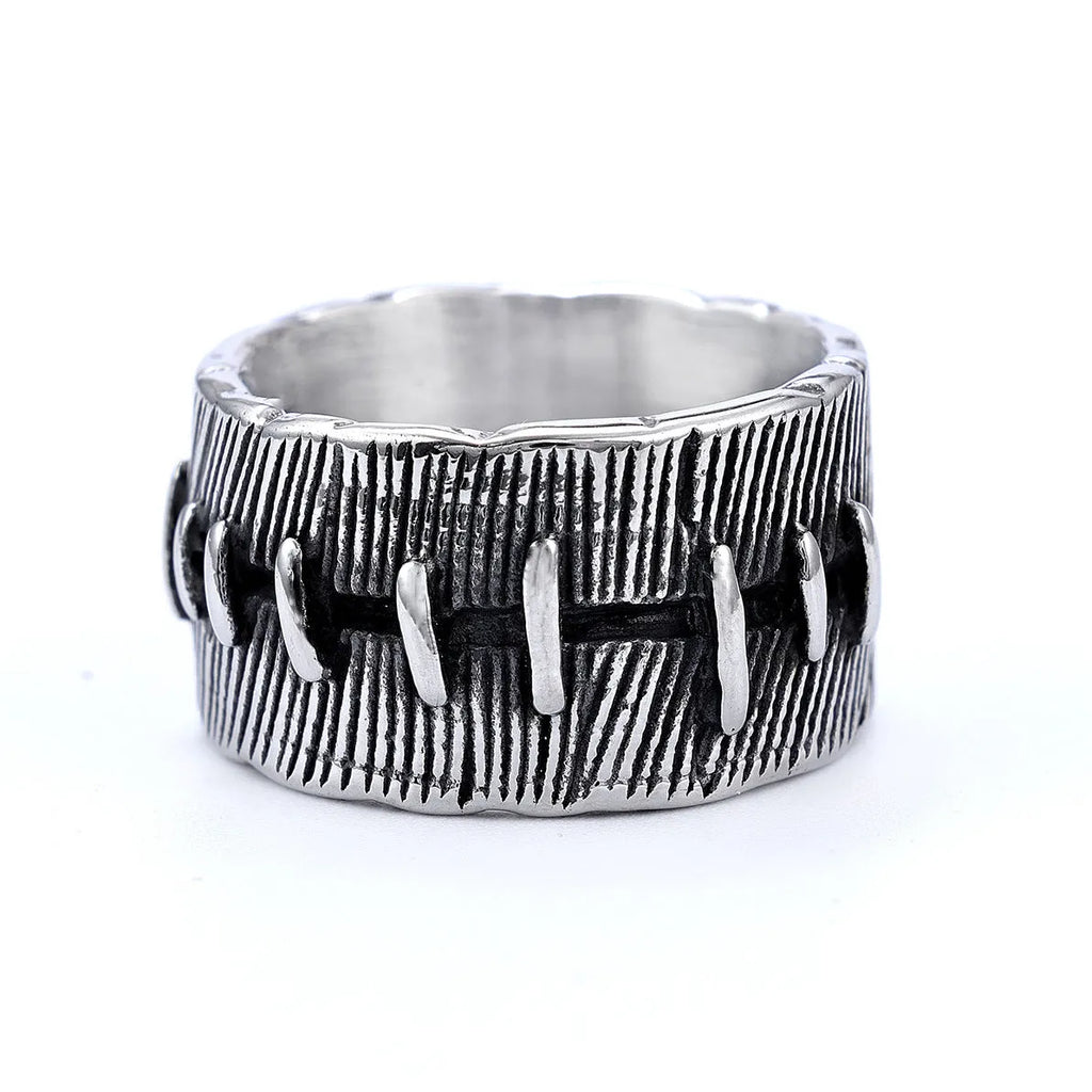 Geometric titanium steel double ring with U-shape design in retro colour on a hand.
