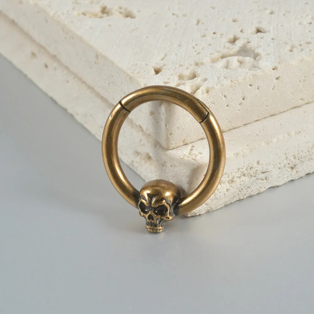 Copper punk earring with detailed ghost head design in antique silver finish for pierced ears
