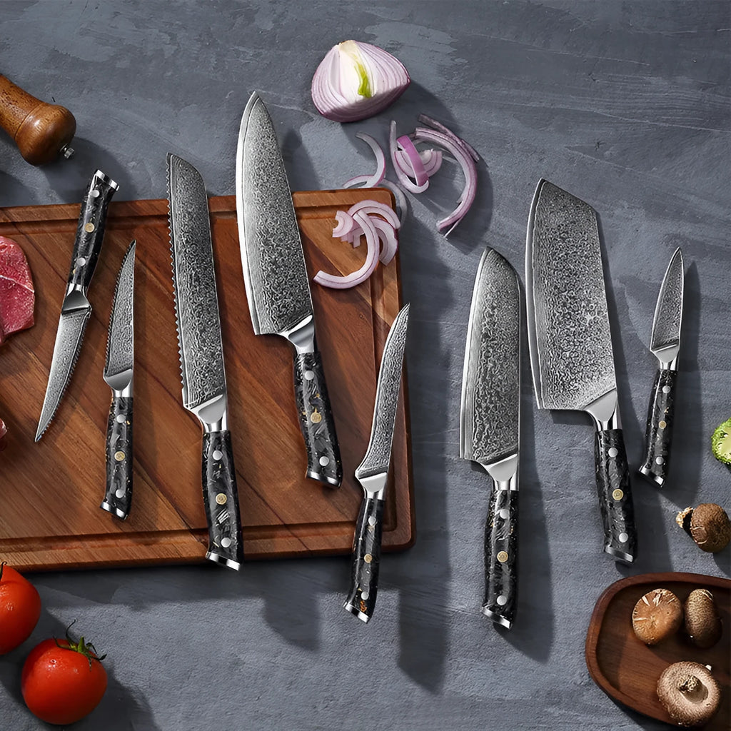 Damascus steel eight-piece kitchen knife set showing fishbone pattern on blades, including fruit, steak, boning, and chef's knives.