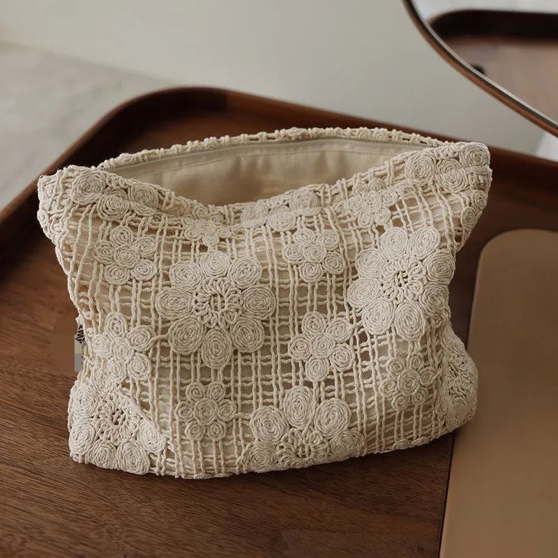 Handmade corduroy cosmetic bag with crocheted hollow flowers and ethnic embroidery, rope handle