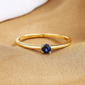 Copper geometric ring with a single diamond shape on a round band, shown in white, red, green, and blue colour options.