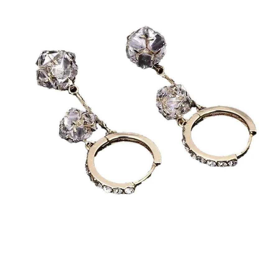 Women's silver drop earrings with confession balloon and rhinestone ball pendants and tassel detailing