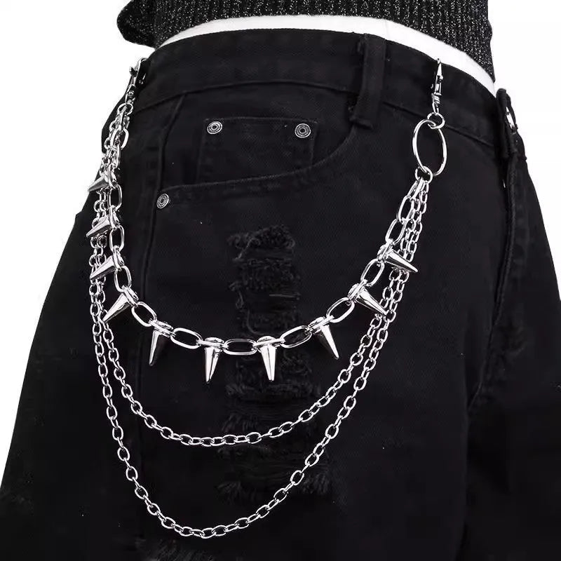Silver metal pants chain with double layer design and punk rivet ornaments on dark background