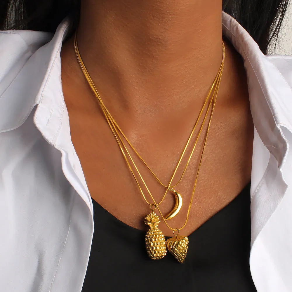 Women's stainless steel fruit necklace with apple, grape, watermelon, pineapple, strawberry, banana pendant designs on regular chain.