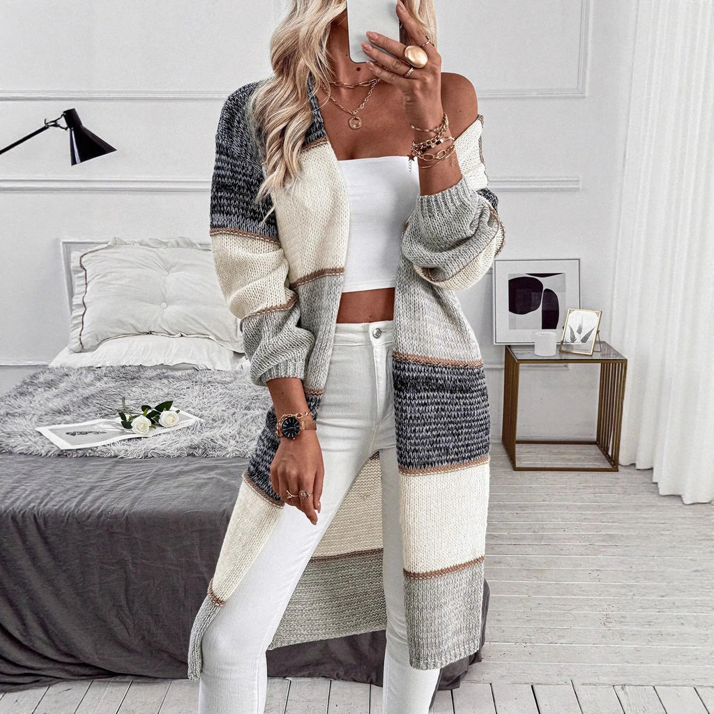 Grey striped women's knitted cardigan with long sleeves and loose fit