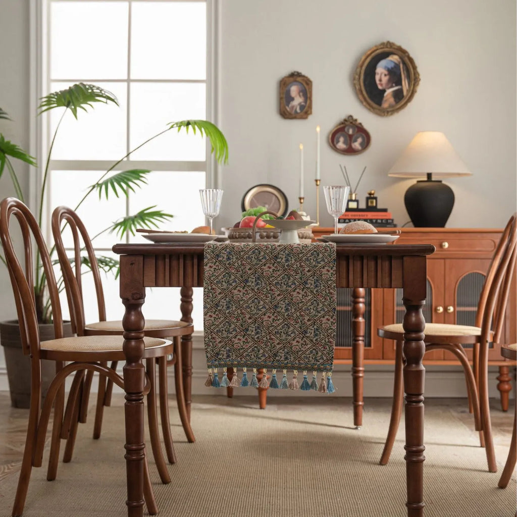 Dark blue Nordic Jacquard bouquet pattern table runner with tassel trim, 32cm wide.