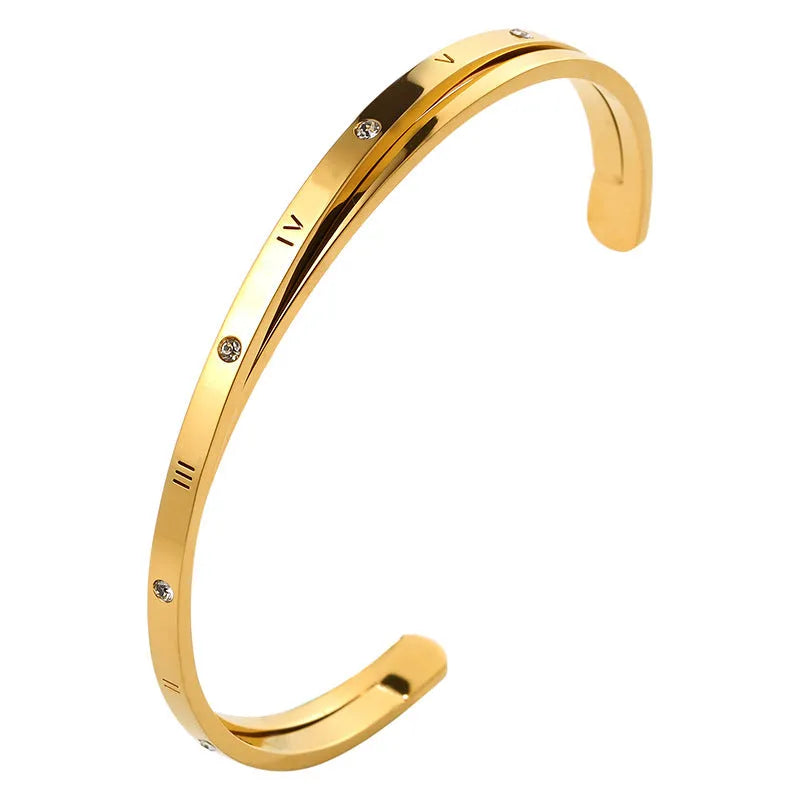 Open-ended stainless steel bracelet for women with inlaid zircon stones, shown in gold colour.