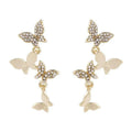 Women's copper butterfly drop earrings with four motifs in gold colour