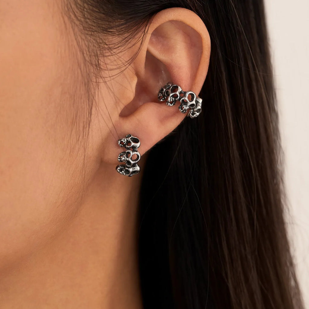 Stainless steel skull ear clip earrings with hollow geometry design and electroplated finish