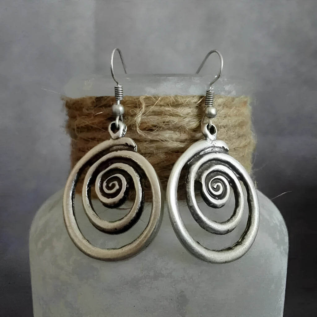 Silver geometric spiral earrings with distressed finish and vintage ethnic style design