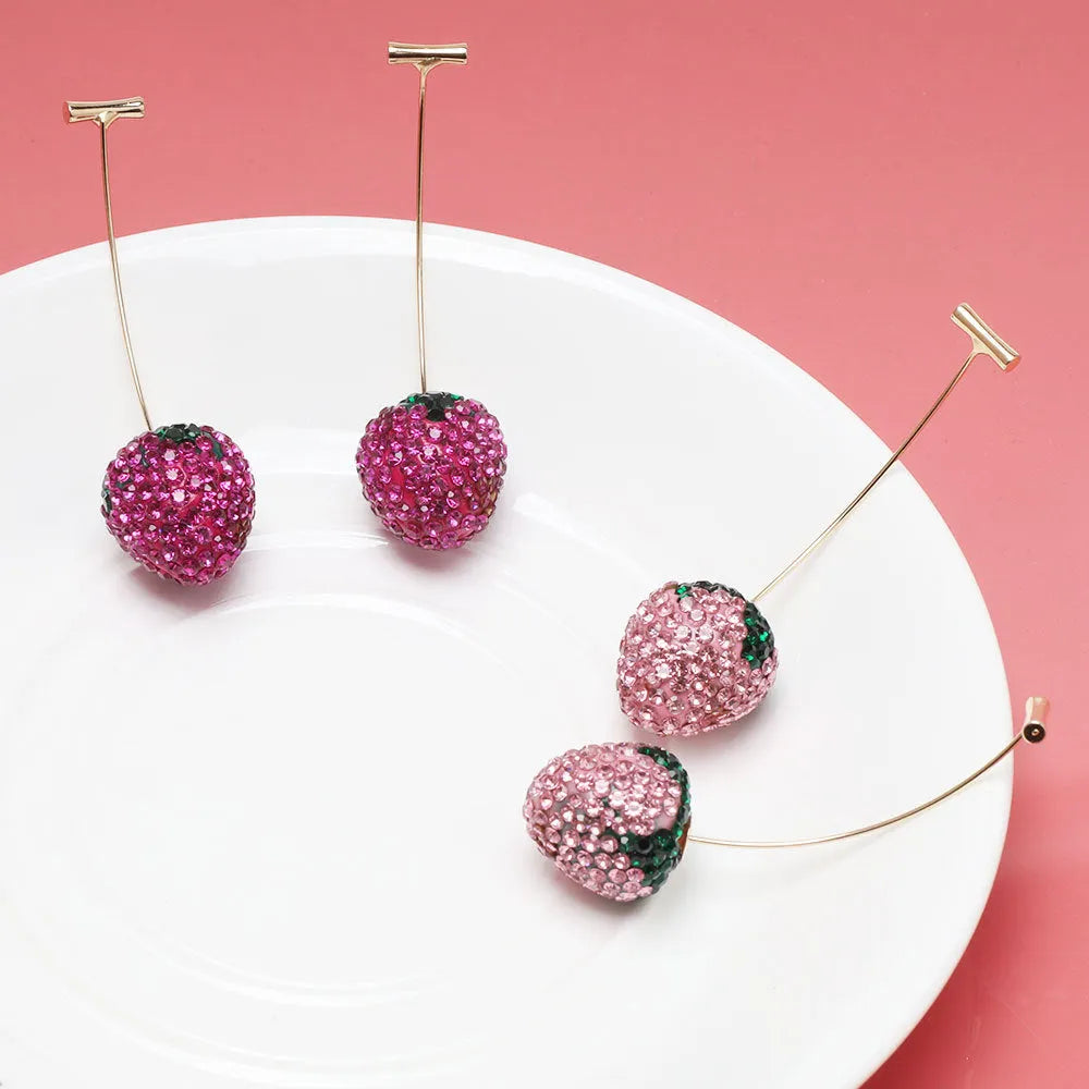 Geometric strawberry-shaped alloy earrings with spot-drill texture, shown in red colour.