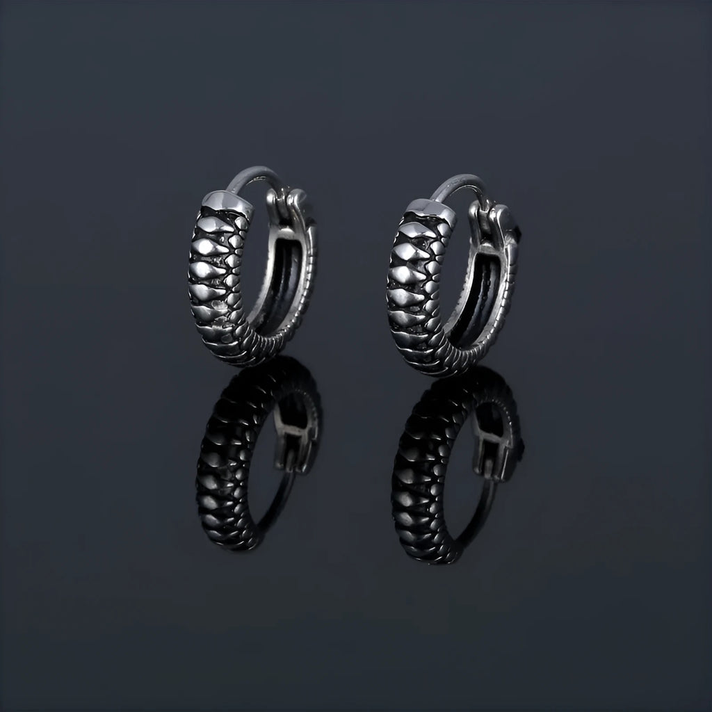 Silver geometric striped drop earrings with retro twist design and round sports-style elements
