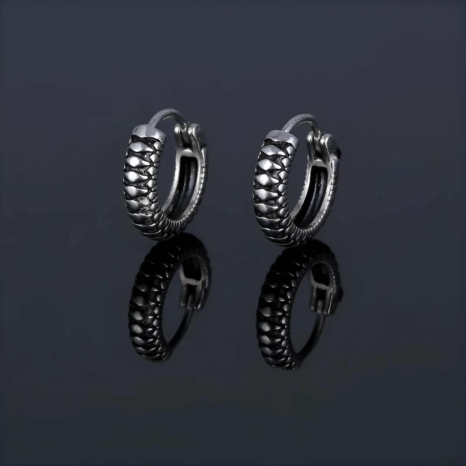Silver geometric striped drop earrings with retro twist design and round sports-style elements