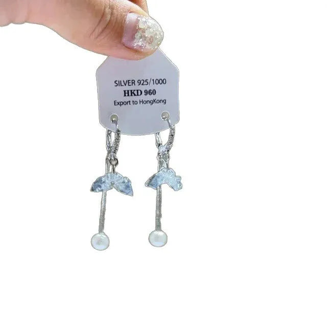 Geometric alloy clip-on earrings with rhinestone stars, a heart design, and dangling tassels.