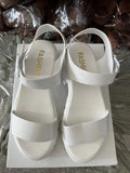 Beige women's platform sandals with peep toe and ankle strap buckle on a white background.