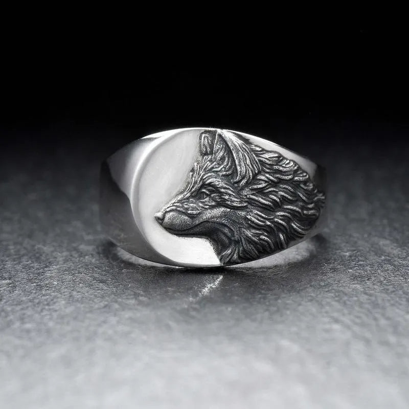 Men's silver geometric wolf head alloy ring on a dark background, showing detailed retro design.