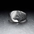 Men's silver geometric wolf head alloy ring on a dark background, showing detailed retro design.