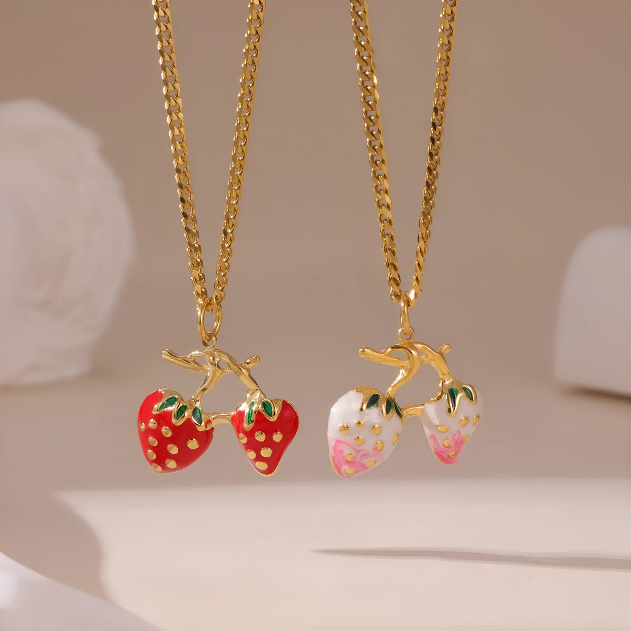 Stainless steel strawberry pendant necklace with red and white gradient colour finish.