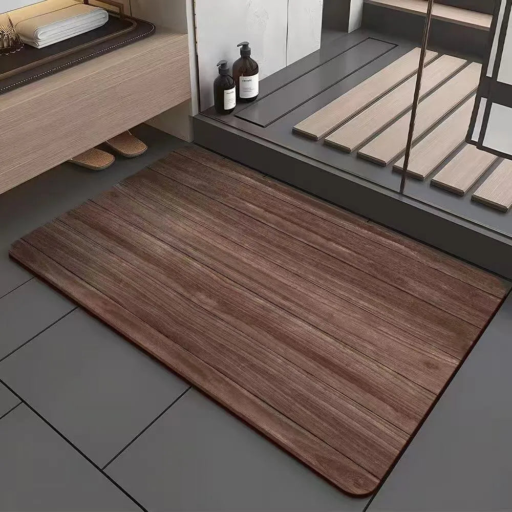 American-style square bath mat with wood grain pattern on a bathroom floor.