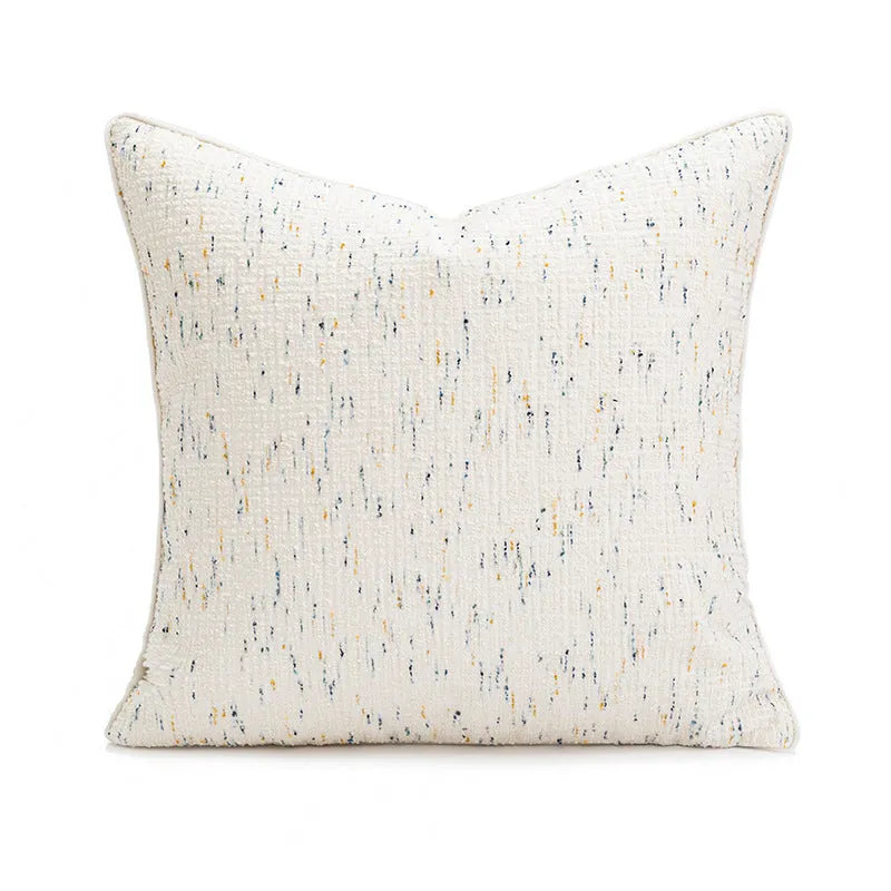 Solid colour decorative pillow cushion in red coffee colour on a living room sofa