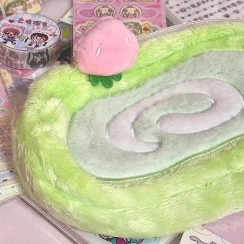 Grey and cream Swiss roll cake design velvet pencil case rolled up with pens visible