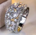 Women's round hollow copper fashion ring showing open design with metal plating and coloured accent options