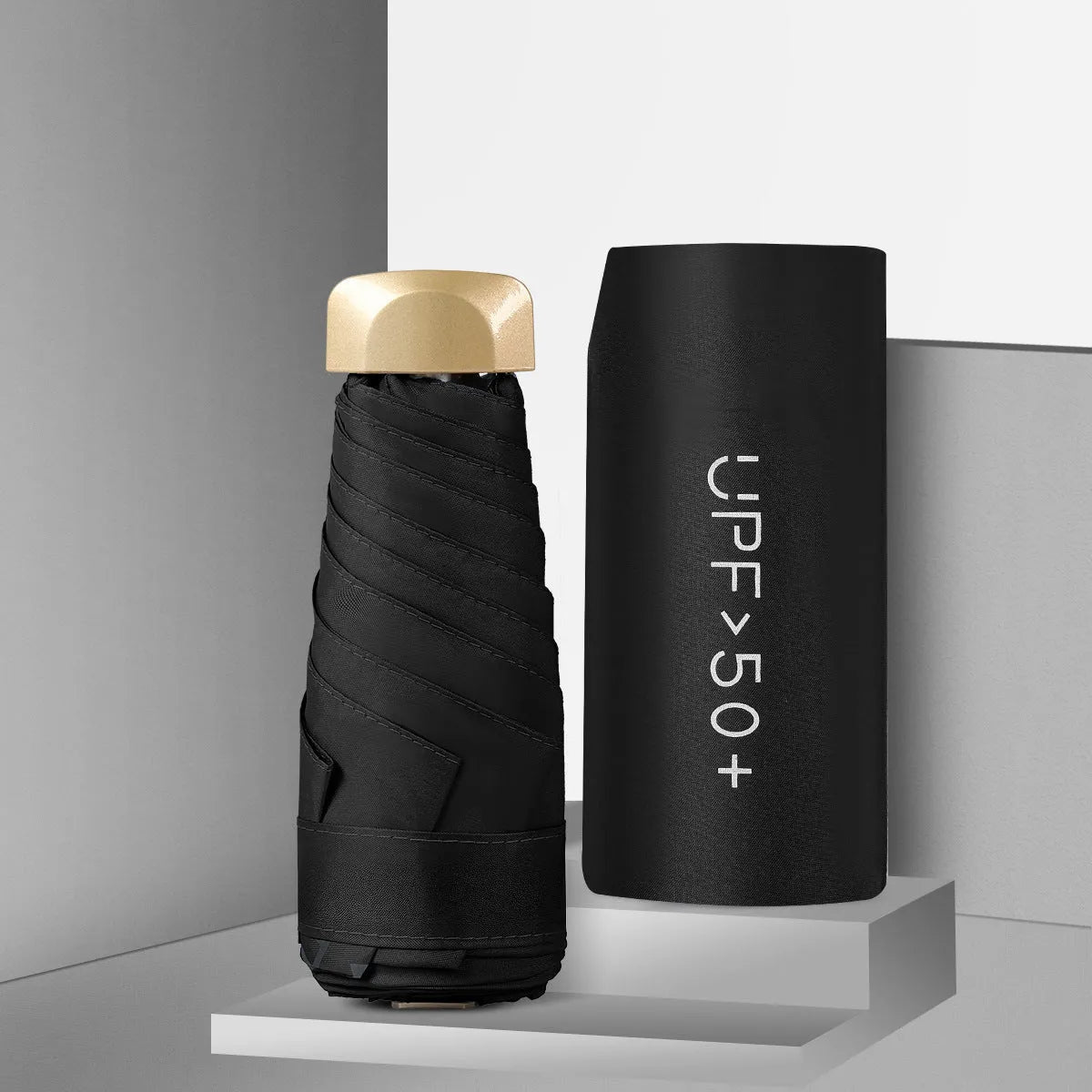 Five-fold mini pocket sun umbrella with rubber handle shown in open position