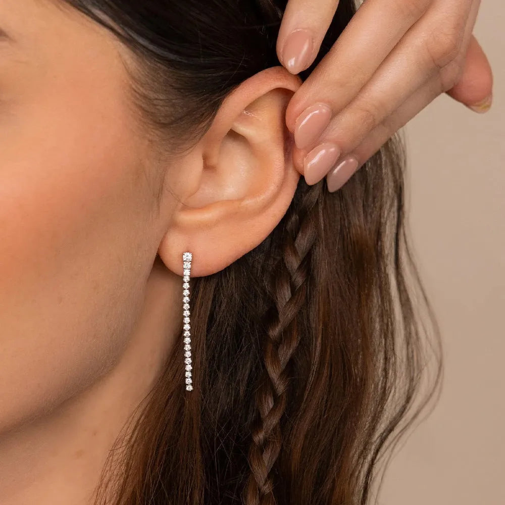 Geometric line design stainless steel earrings with zircon stones in gold and steel colour options.
