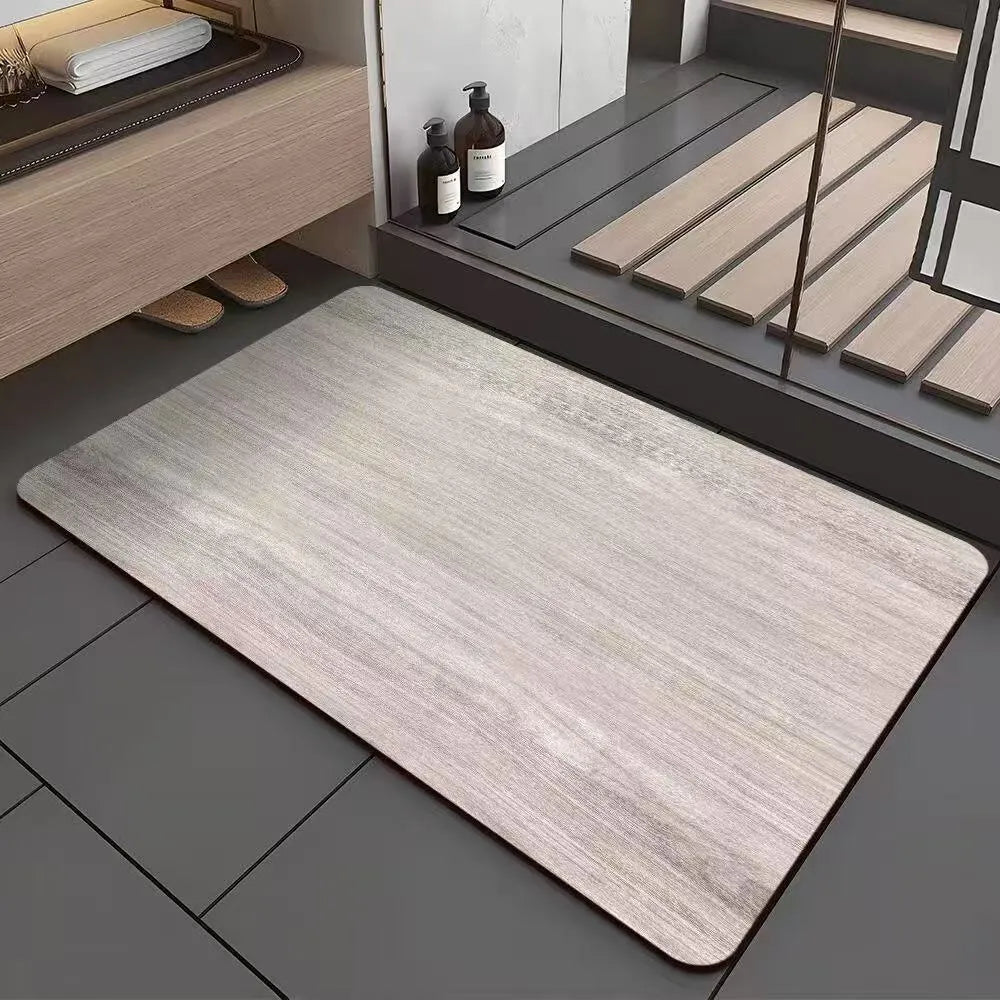 American-style square bath mat with wood grain pattern on a bathroom floor.