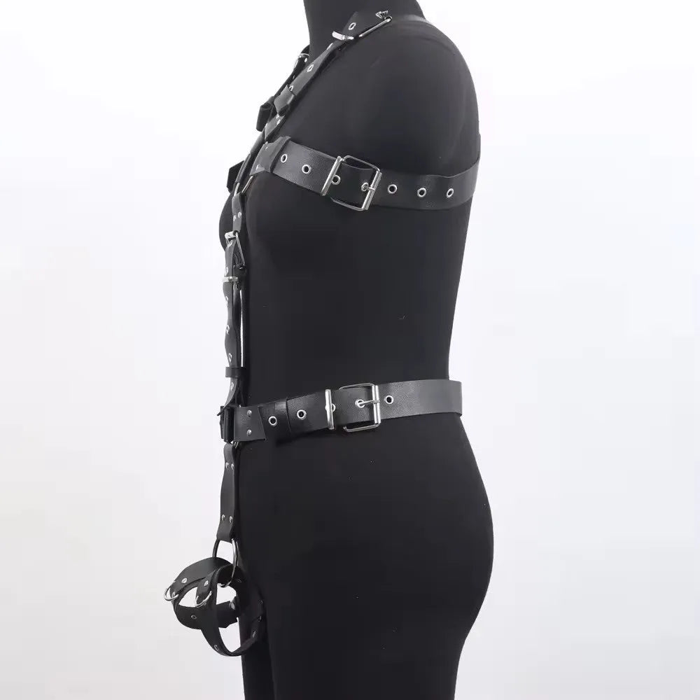 Thin black patent leather shapewear belt with a silver-tone pin buckle on a mannequin waist.
