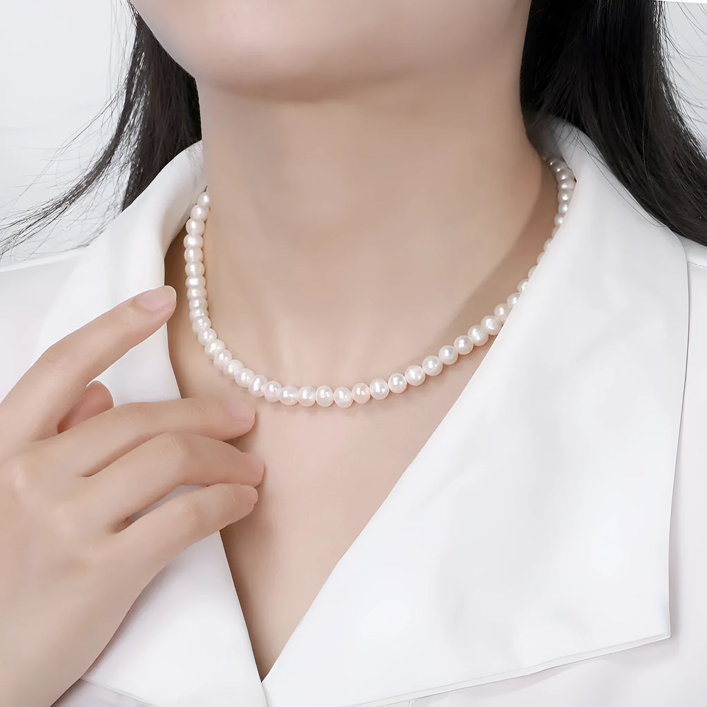Women's freshwater pearl necklace with adjustable sterling silver chain showing 6-7mm natural pearls